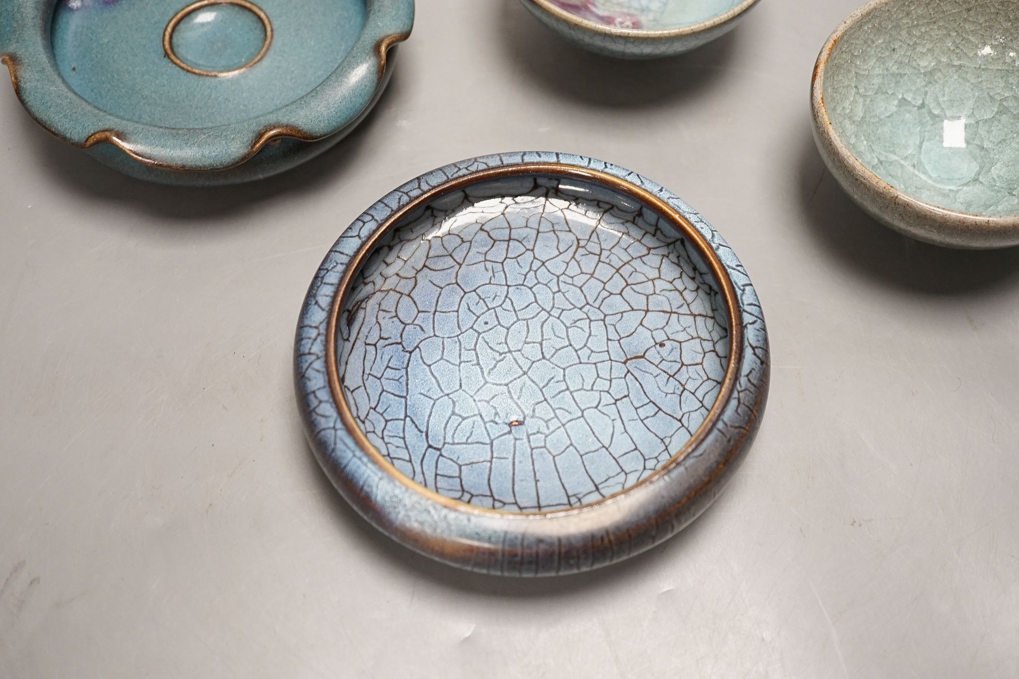 Four Chinese Jun type dishes/bowls, largest 14 cms diameter.